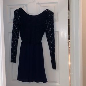 A dark blue dress with bow on the back.
